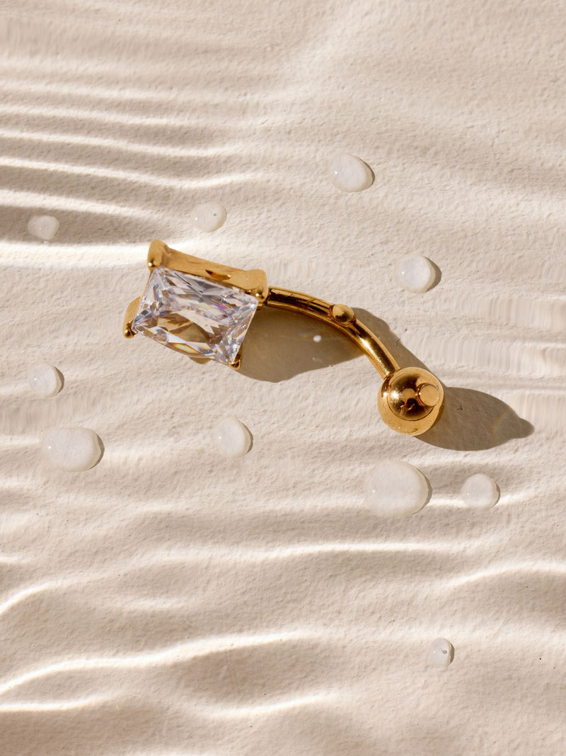 Belly bar with cubic zirconia stone in gold tone (British brand)