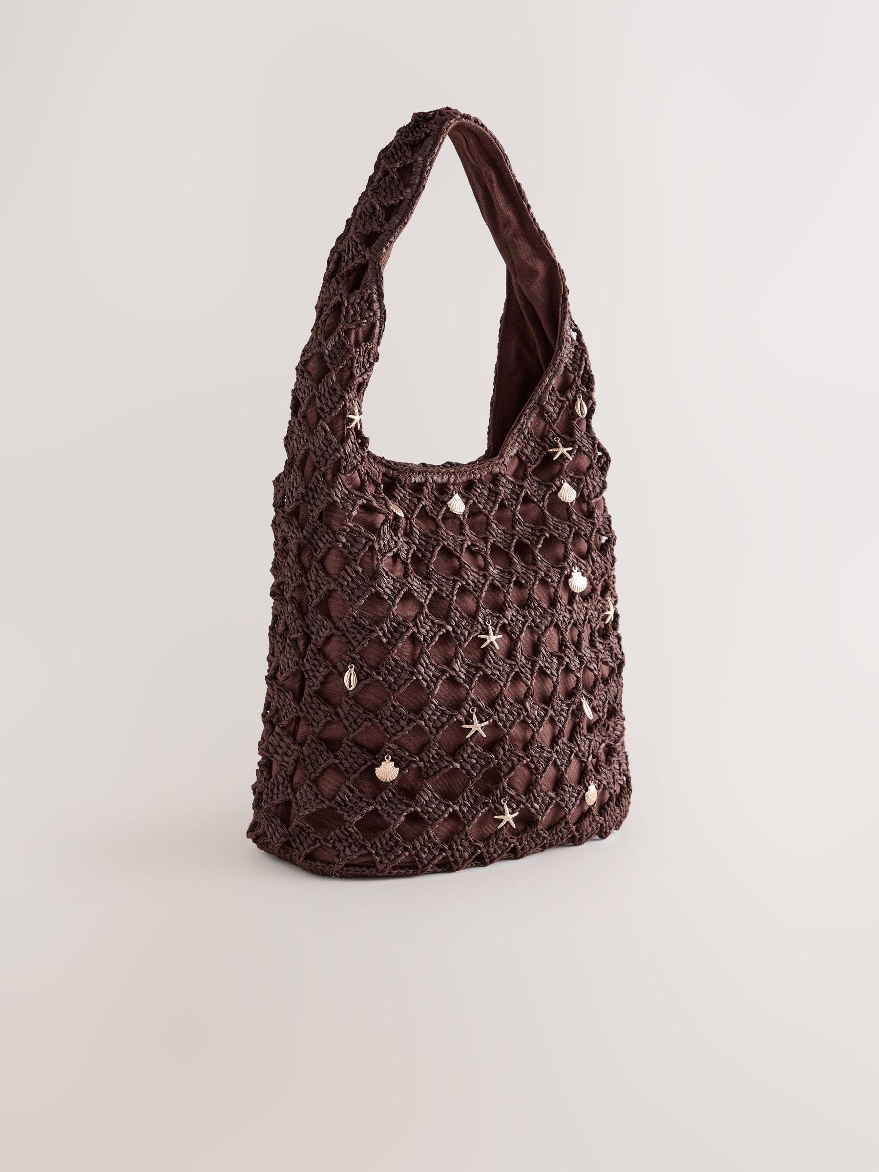 Chocolate brown crochet shoulder bag with shell charms - British product