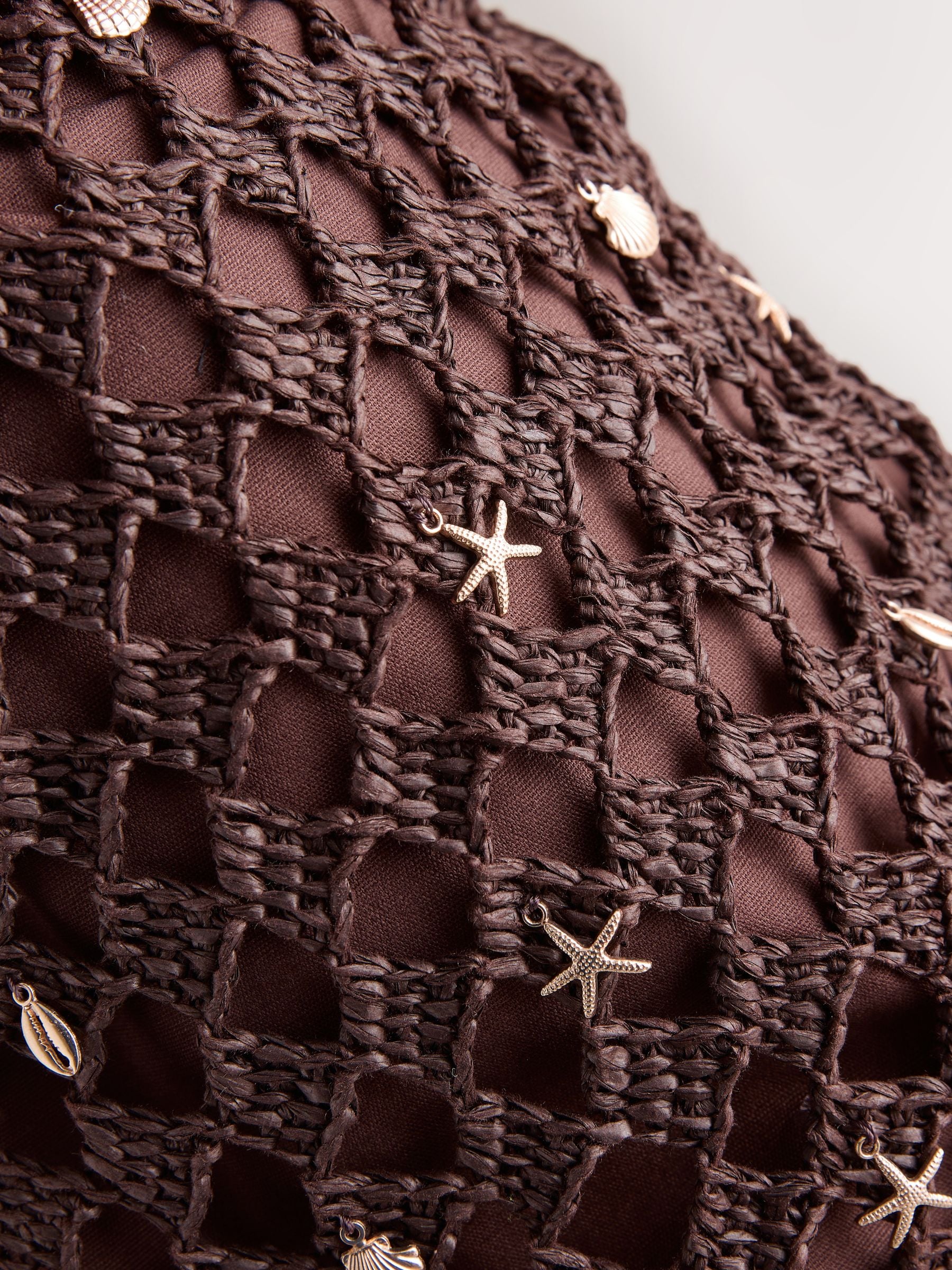 Chocolate brown crochet shoulder bag with shell charms - British product