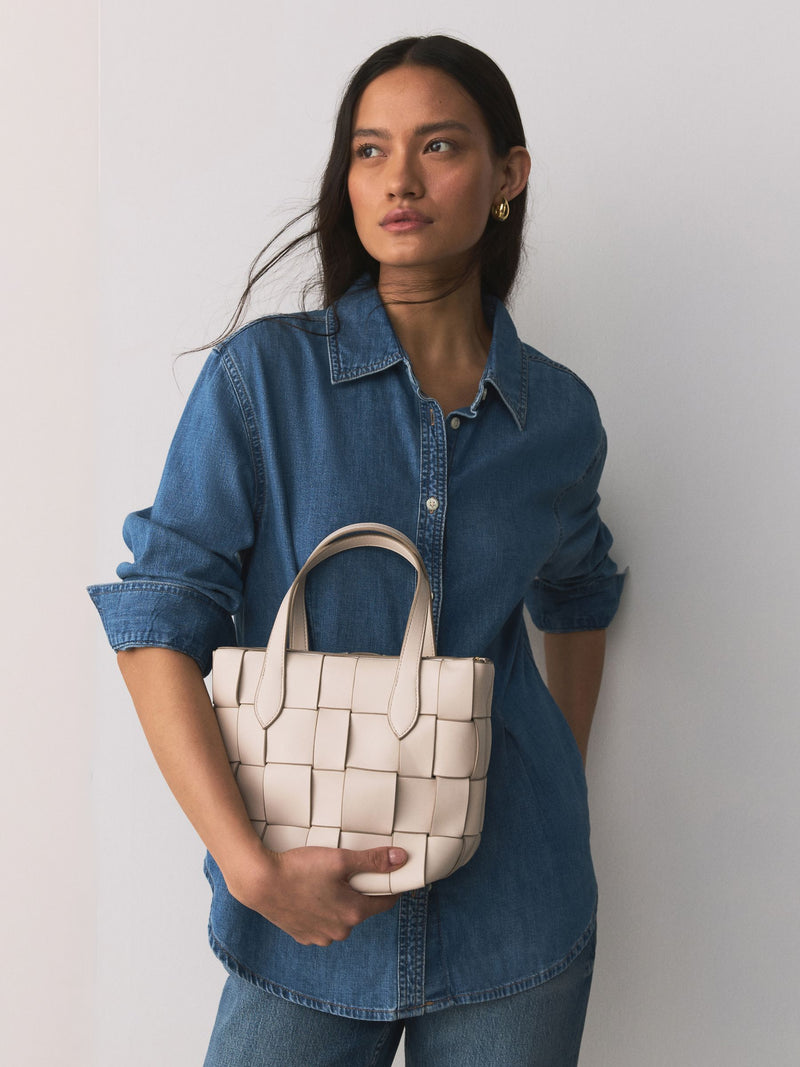 Bone Weave hand held bag with woven texture and recycled lining, imported from the UK