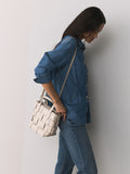 Bone Weave hand held bag with woven texture and recycled lining, imported from the UK