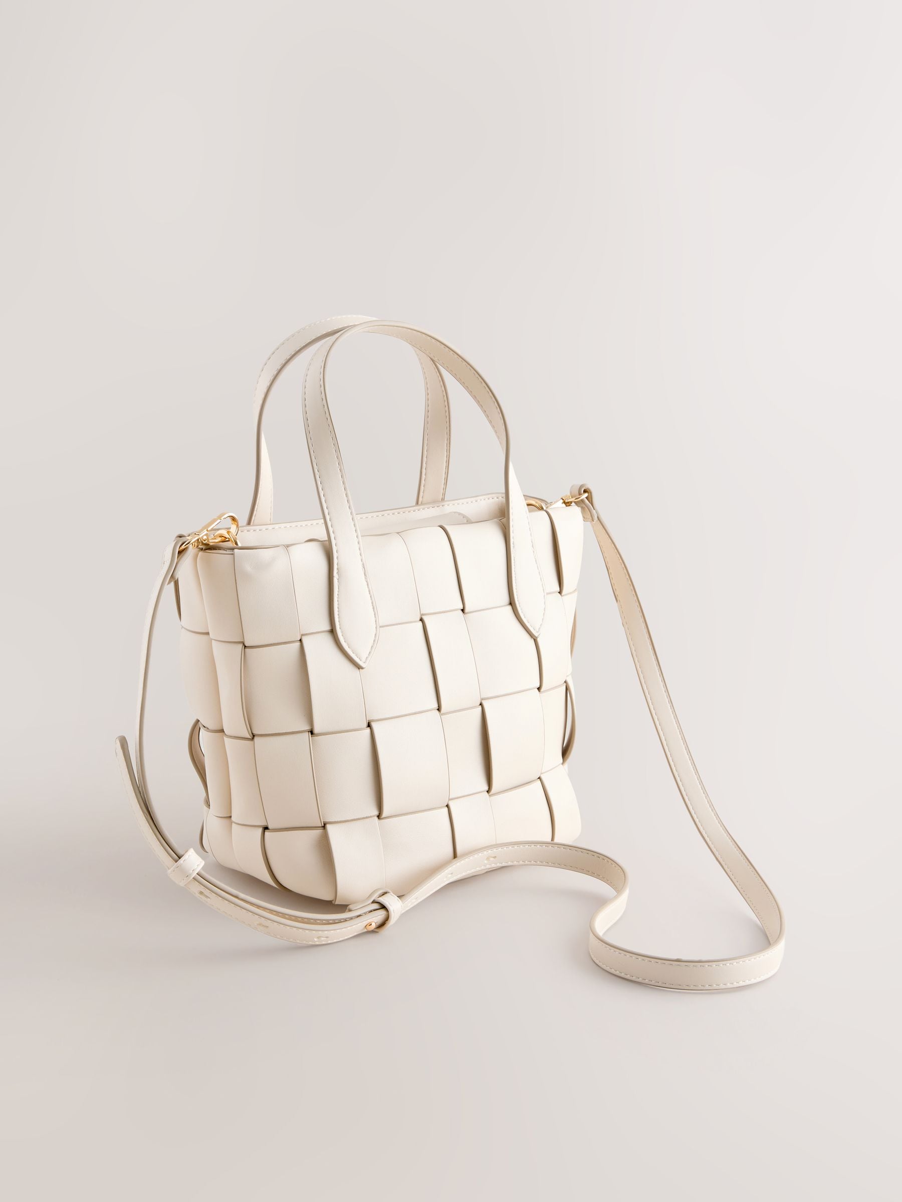 Bone Weave hand held bag with woven texture and recycled lining, imported from the UK