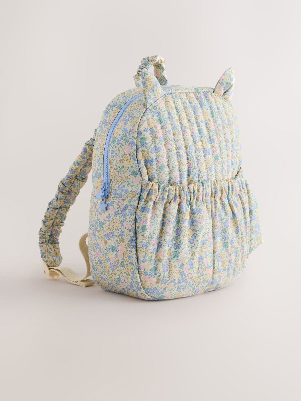 Floral blue ditsy cat backpack with quilted texture - British product