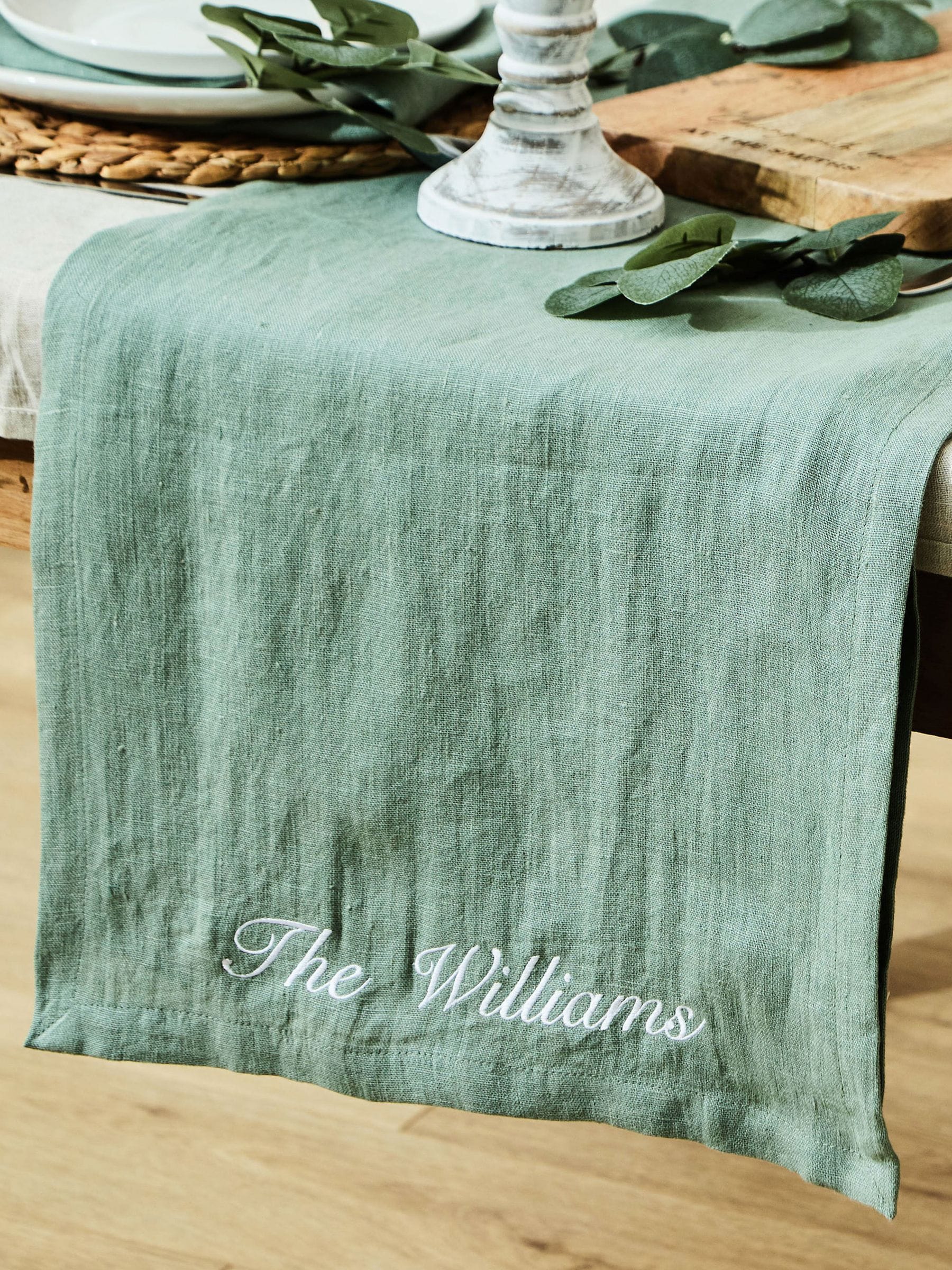 Made Yours Green personalised linen table runner in rosemary green, UK version