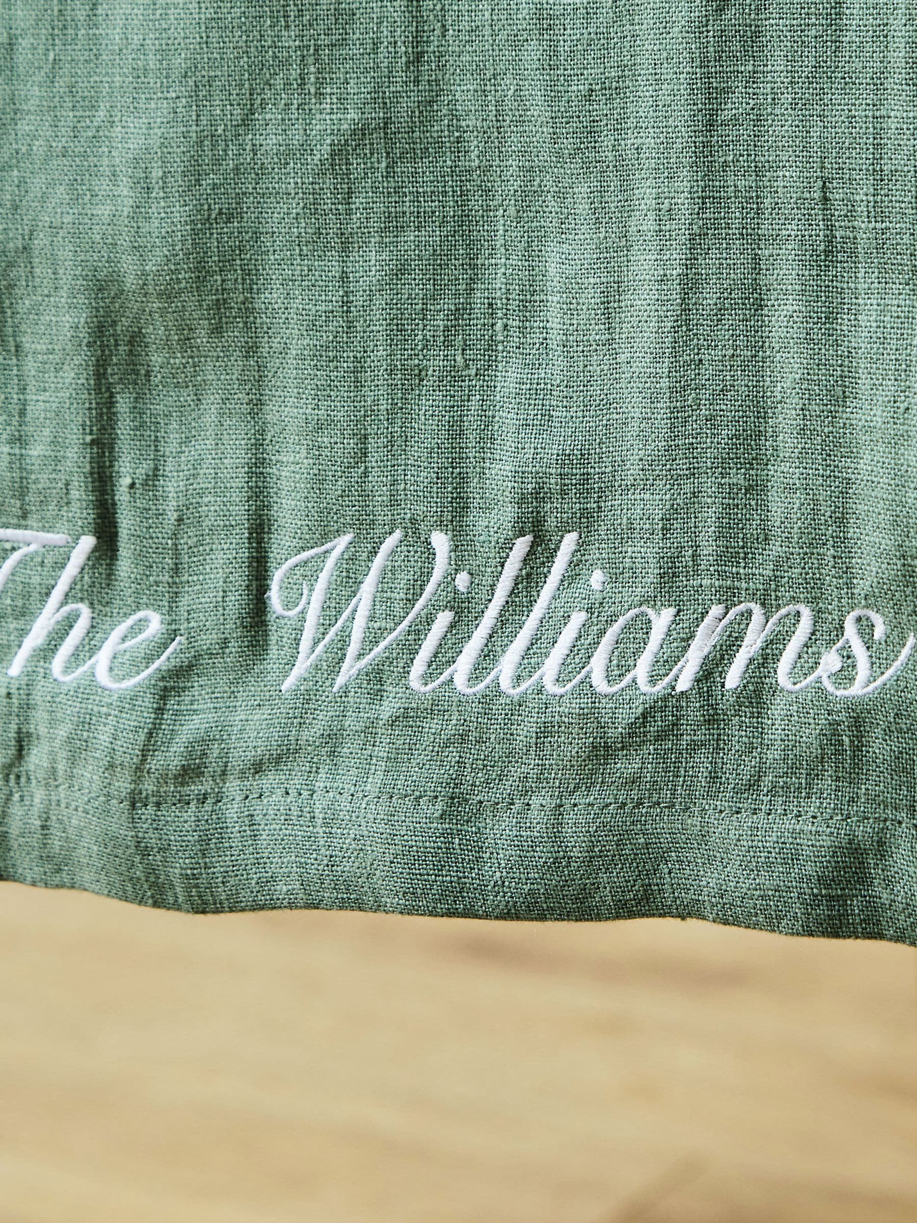 Made Yours Green personalised linen table runner in rosemary green, UK version