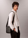 Calvin Klein black raised reporter bag (British brand)