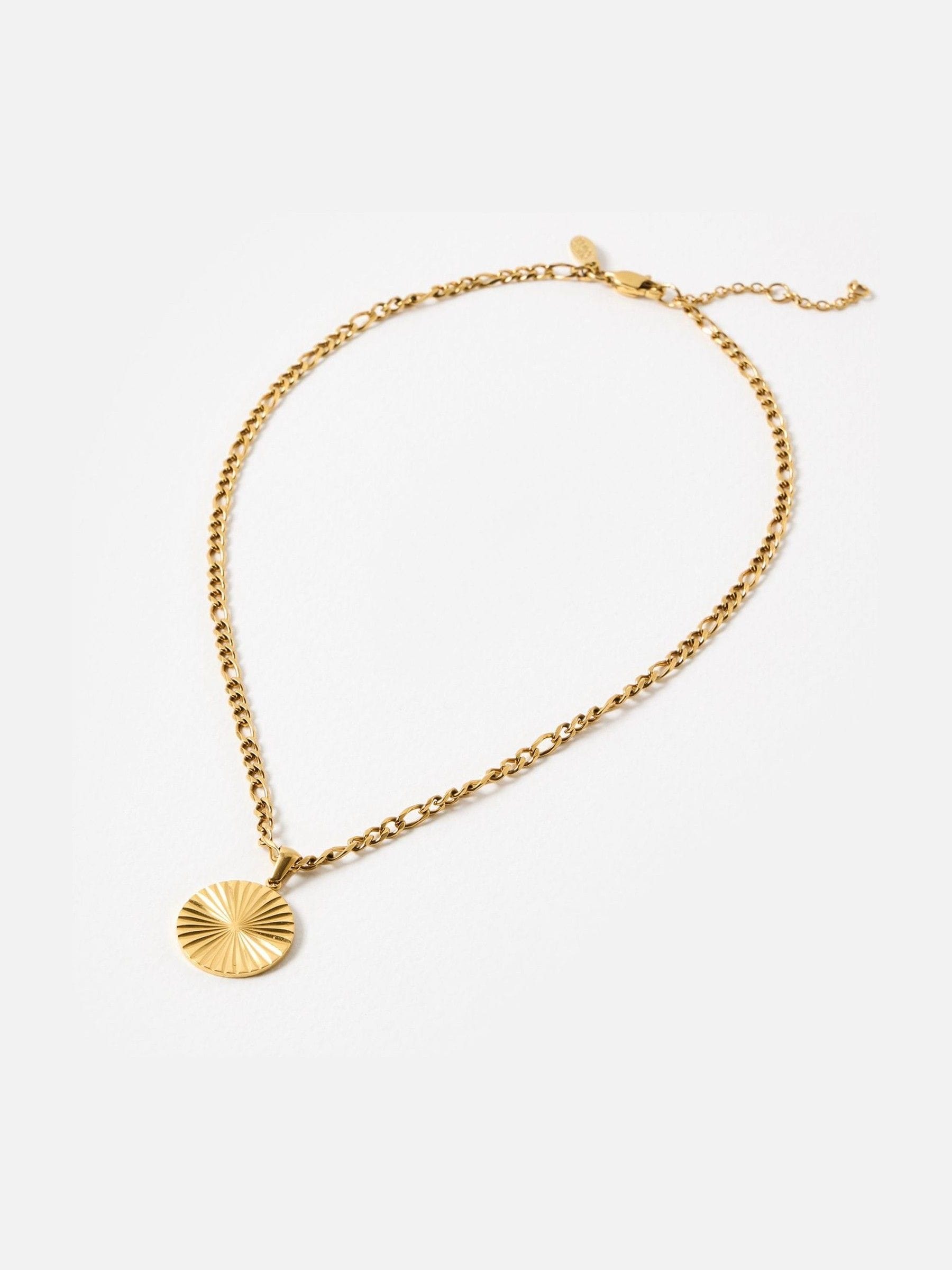 Oliver Bonas gold tone etched disc pendant necklace, imported from the UK