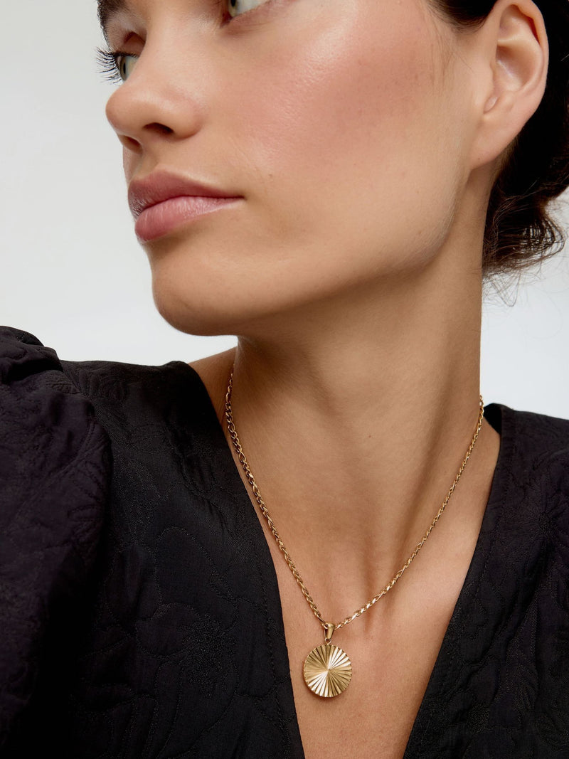 Oliver Bonas gold tone etched disc pendant necklace, imported from the UK
