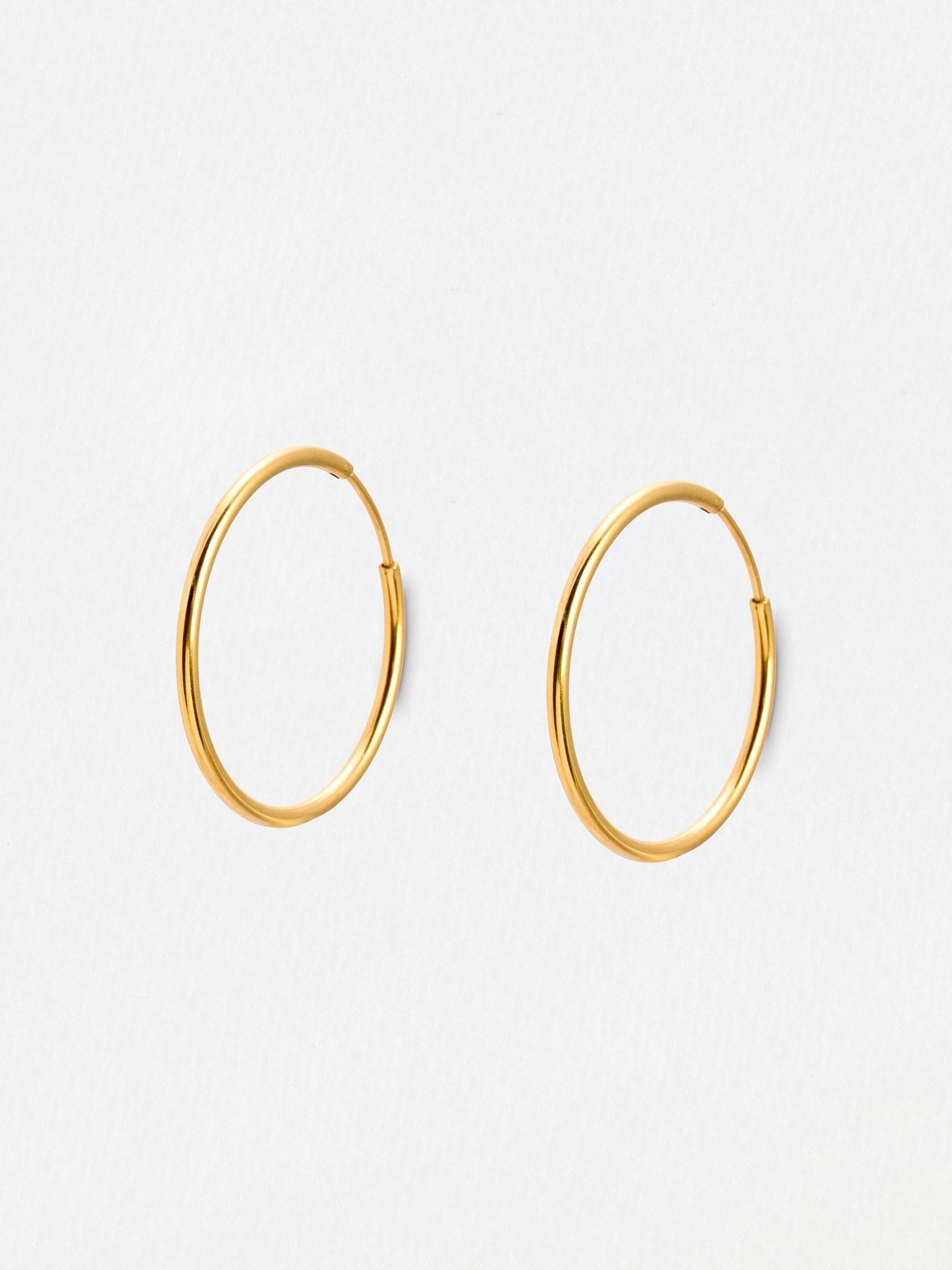 Oliver Bonas gold tone small hoop earrings, UK version