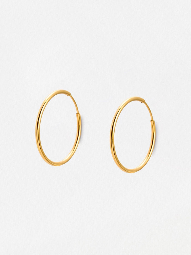 Oliver Bonas gold tone small hoop earrings, UK version