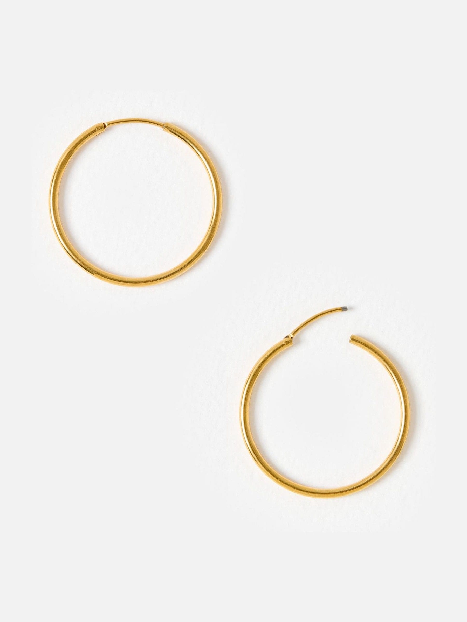 Oliver Bonas gold tone small hoop earrings, UK version