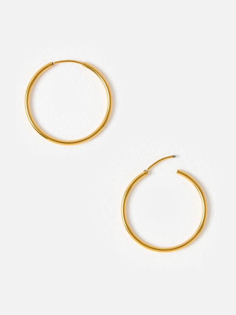 Oliver Bonas gold tone small hoop earrings, UK version