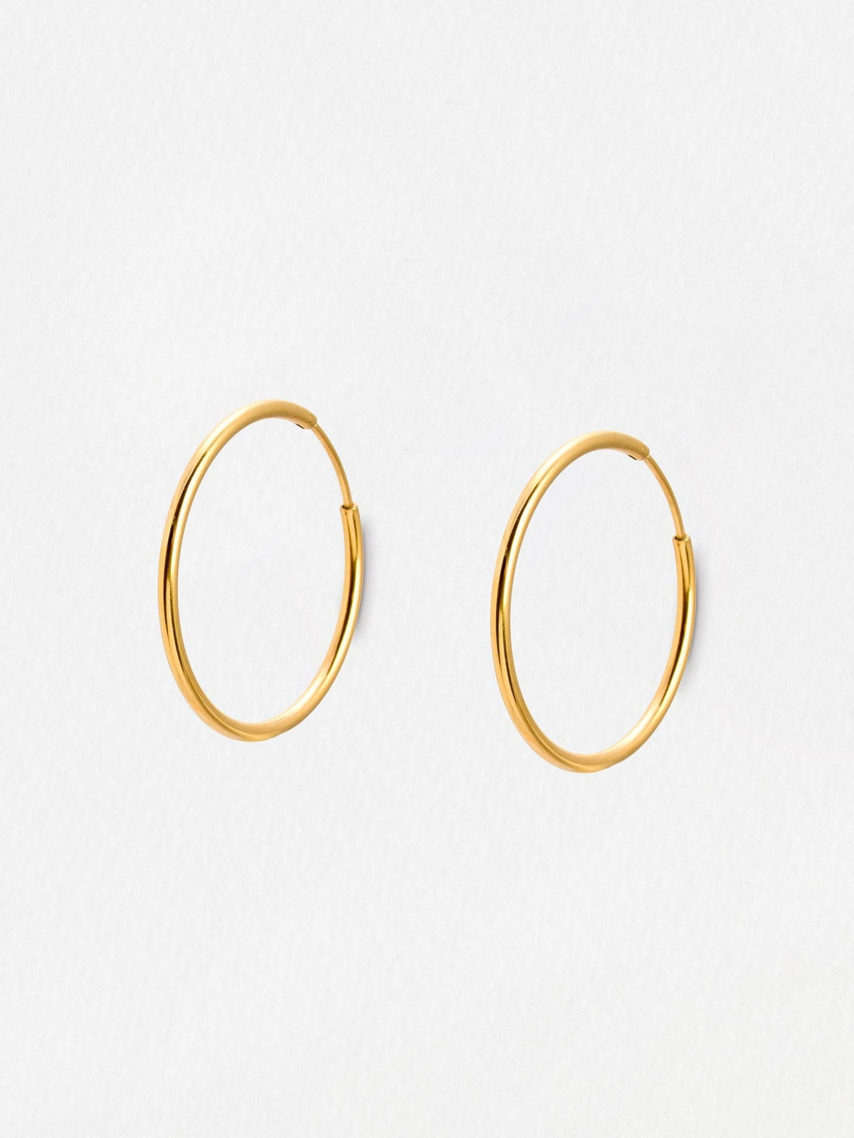 Oliver Bonas gold tone small hoop earrings, UK version
