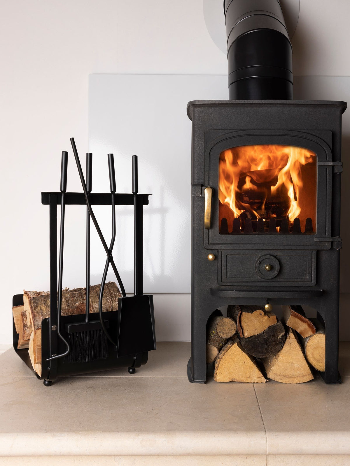 Snug black hazel log holder and fireside companion set (British brand)