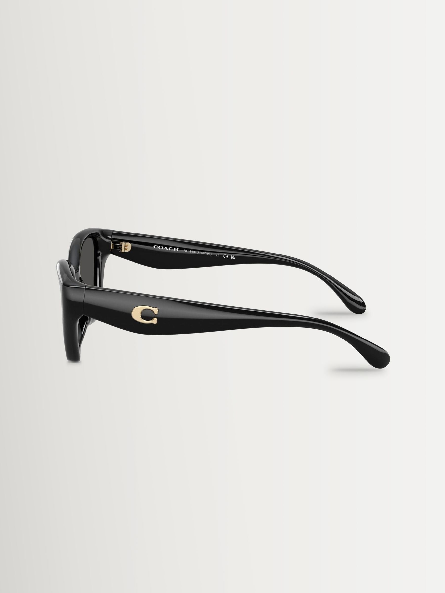 COACH black irregular sunglasses with grey solid lenses, imported from the UK