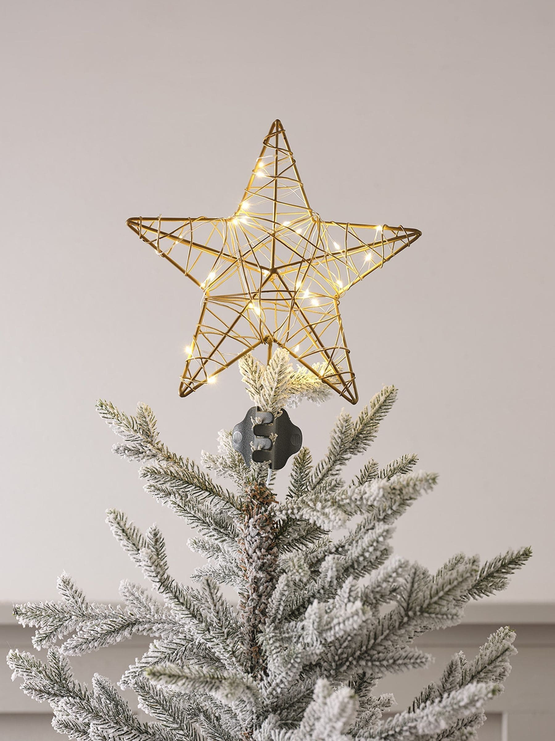 Lights4fun gold star tree topper, imported from the UK