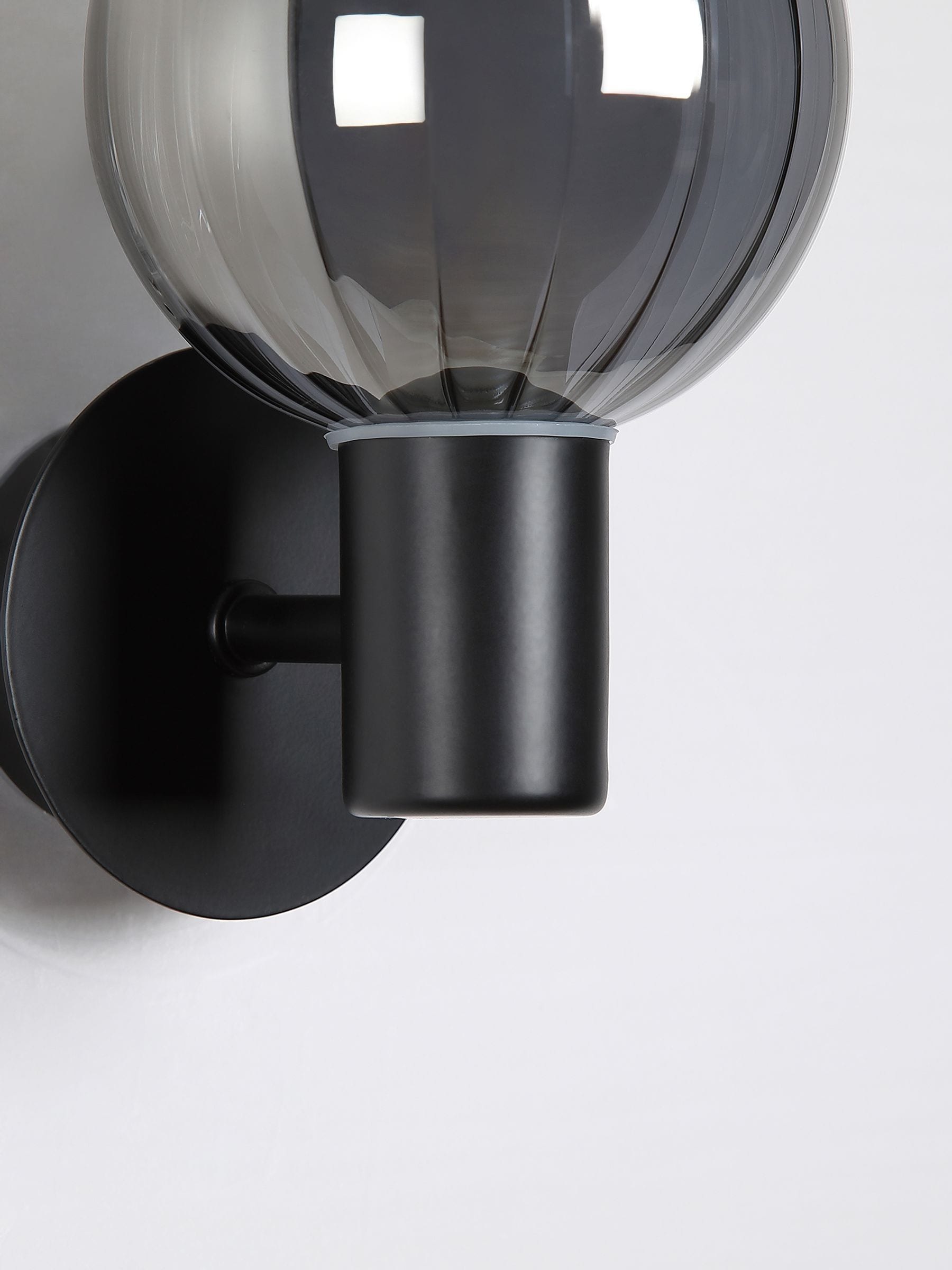 Searchlight black glass ball wall light - British product