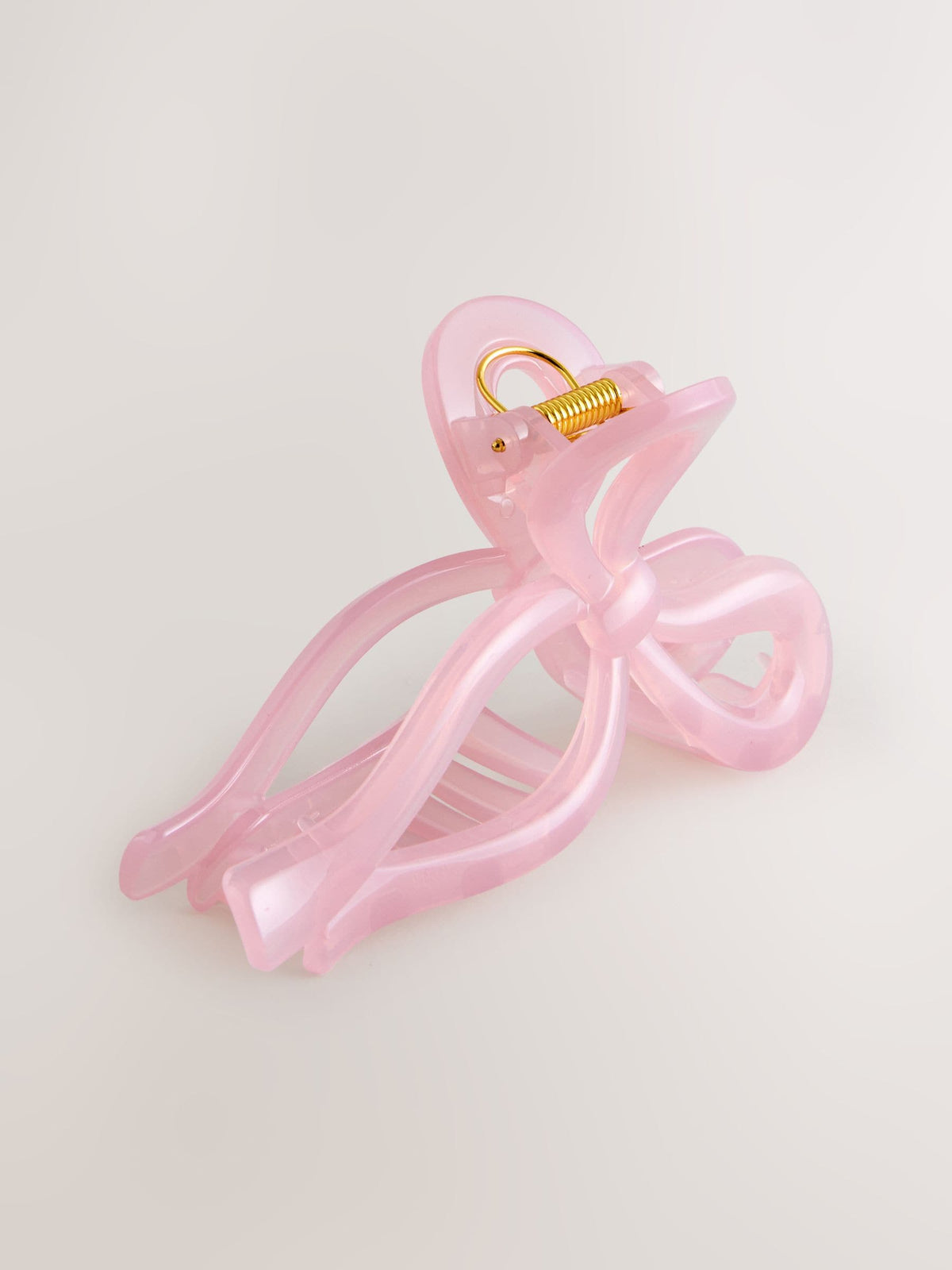 Pink resin bow claw clip (British brand)