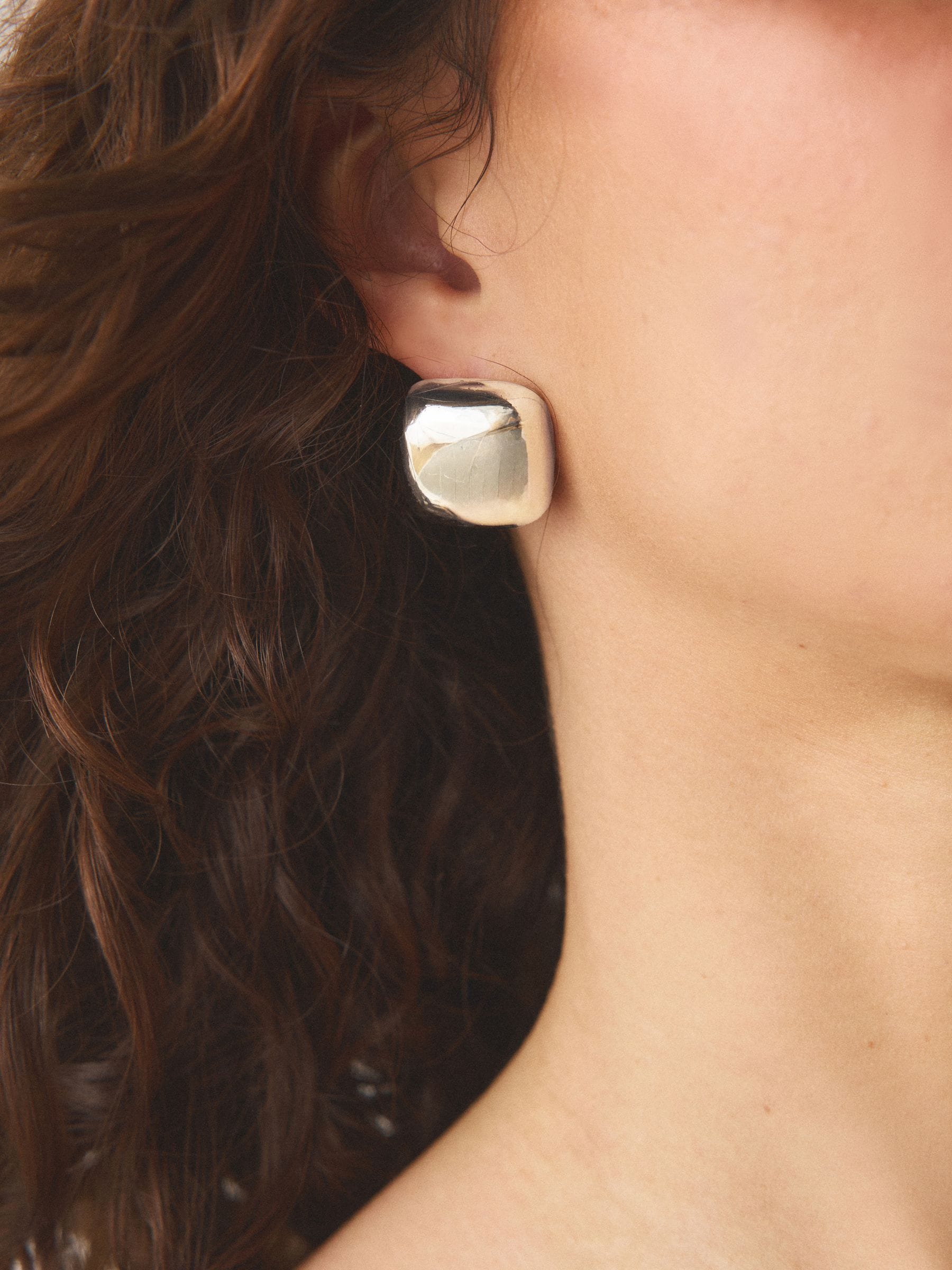 Silver tone square stud earrings in recycled zinc from a British brand