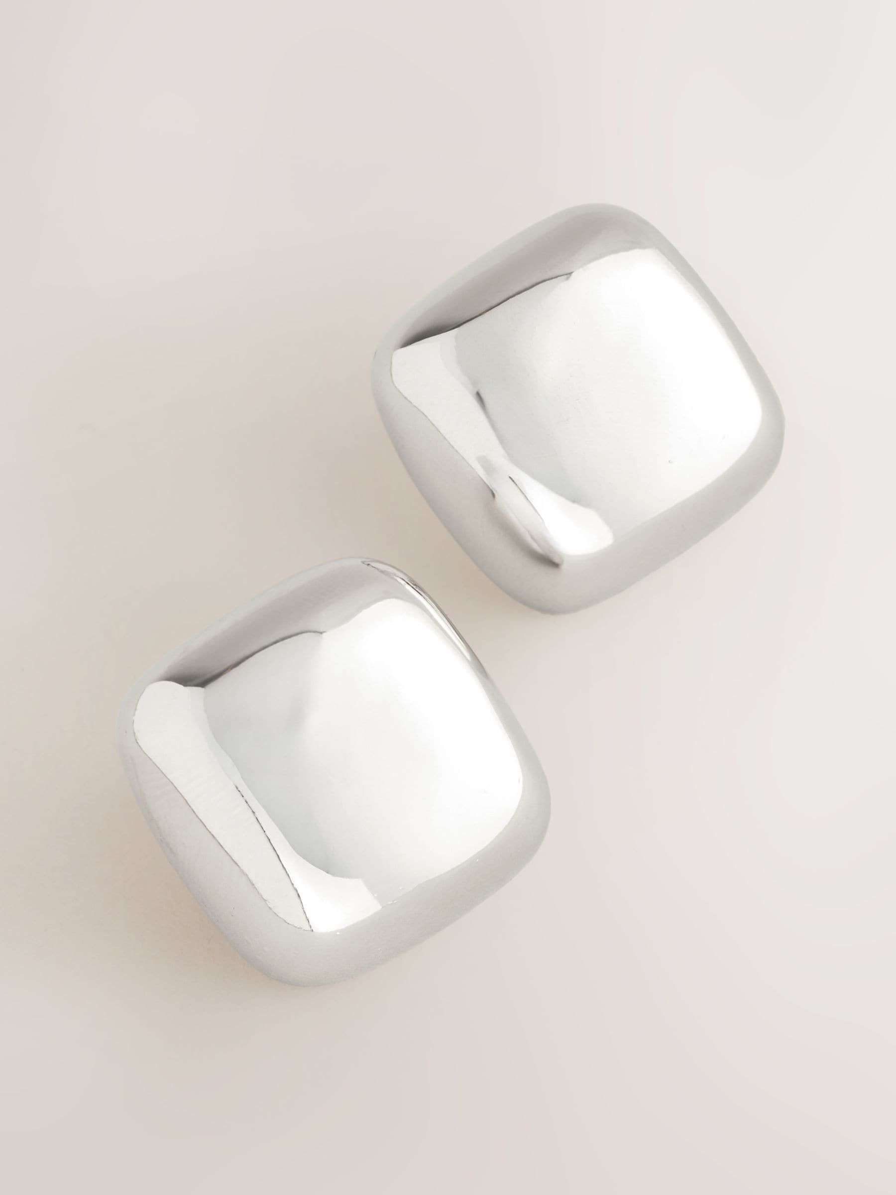 Silver tone square stud earrings in recycled zinc from a British brand
