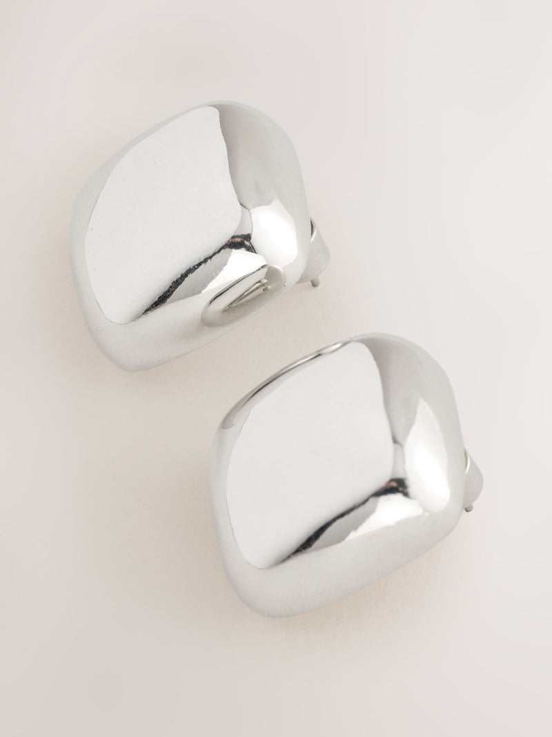 Silver tone square stud earrings in recycled zinc from a British brand