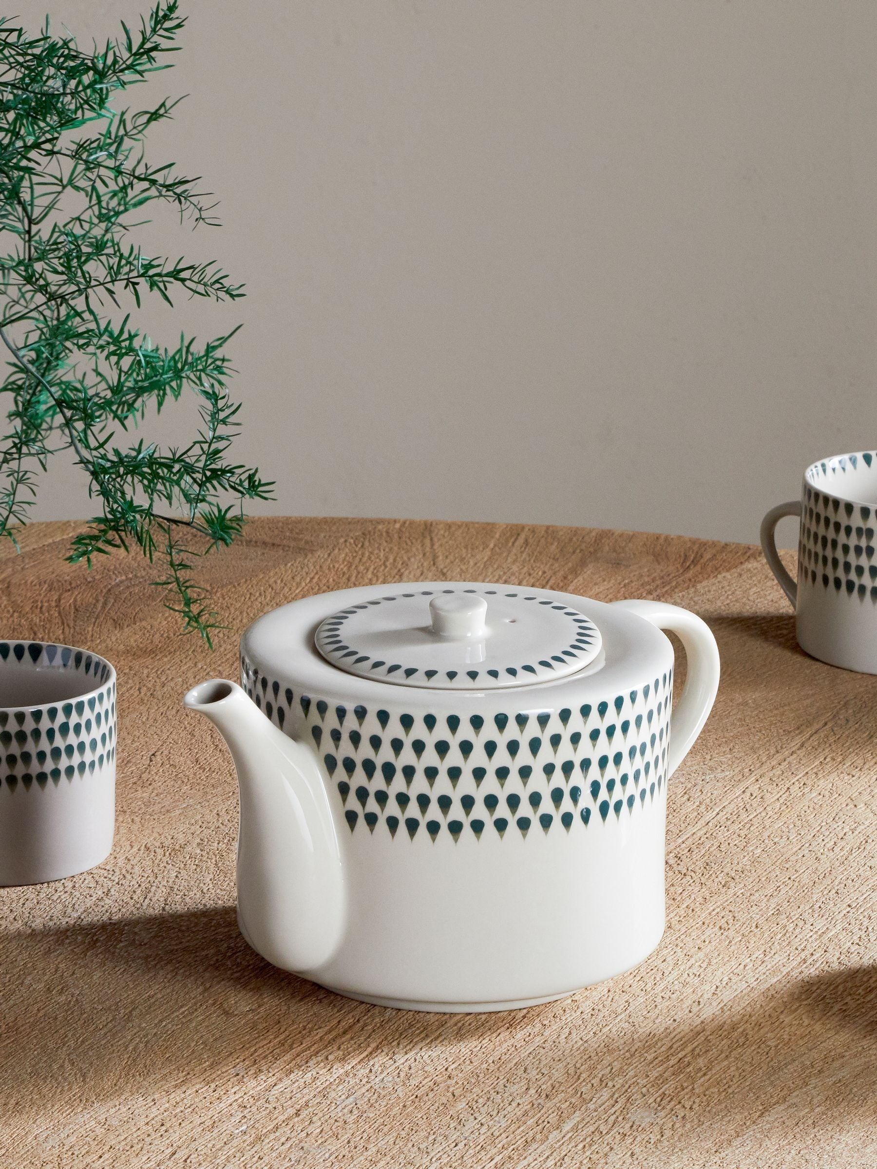 Nkuku cream ceramic teapot with hand-painted drop pattern, UK version