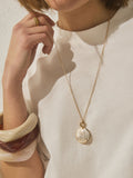 Gold tone etched pendant necklace, imported from the UK