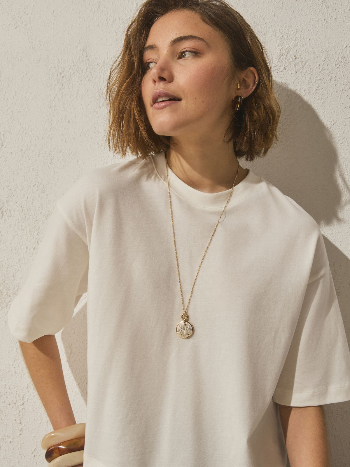 Gold tone etched pendant necklace, imported from the UK