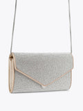 Carvela silver spiral envelope clutch bag, imported from the UK