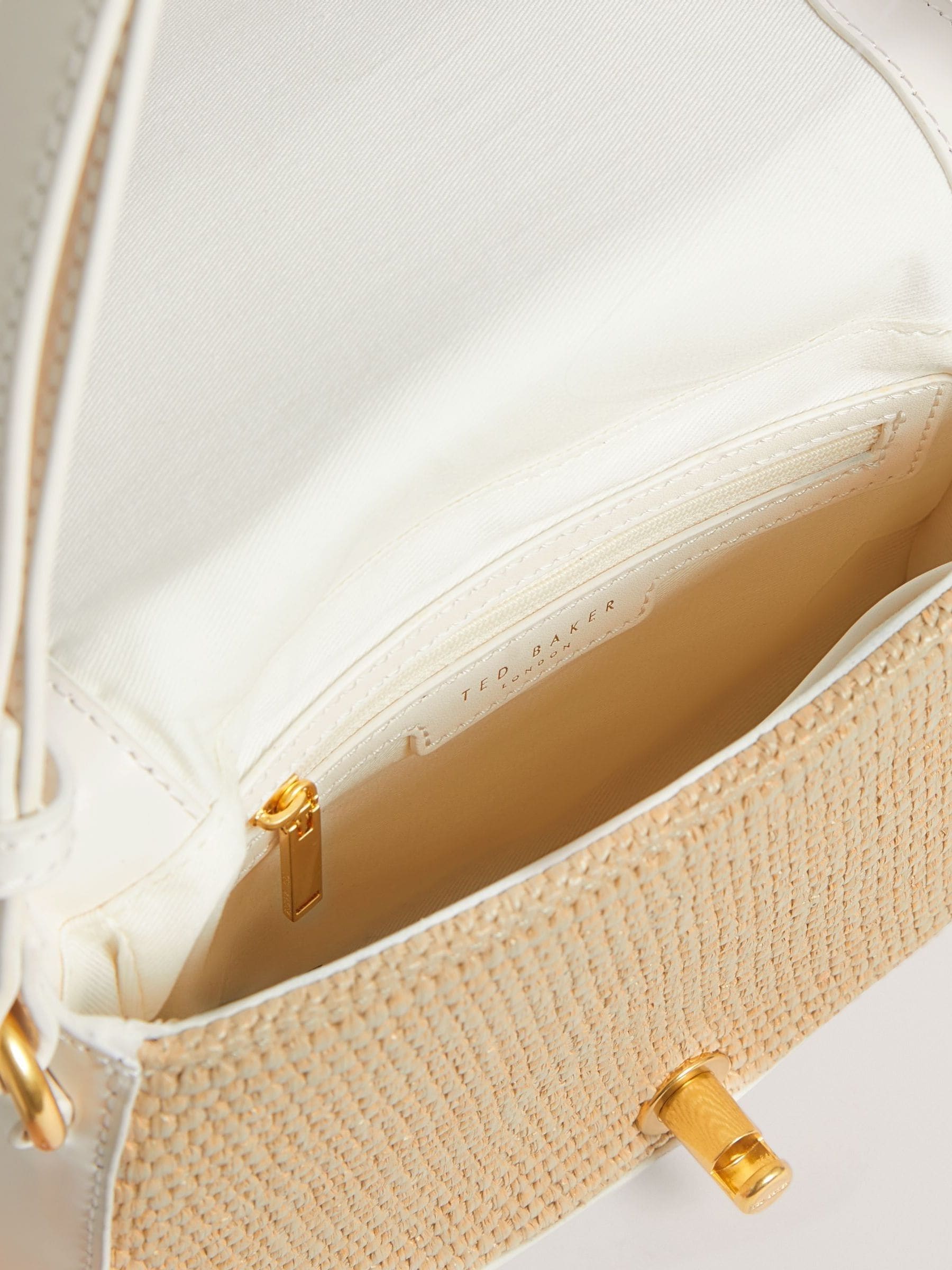 Ted Baker cream shoulder bag with twist lock and raffia trim, UK version