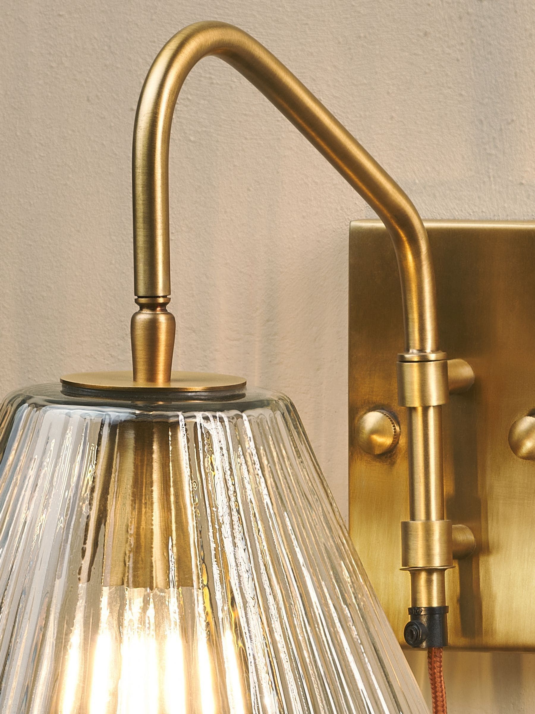 Nkuku antique brass Akoli glass wall lamp, UK version