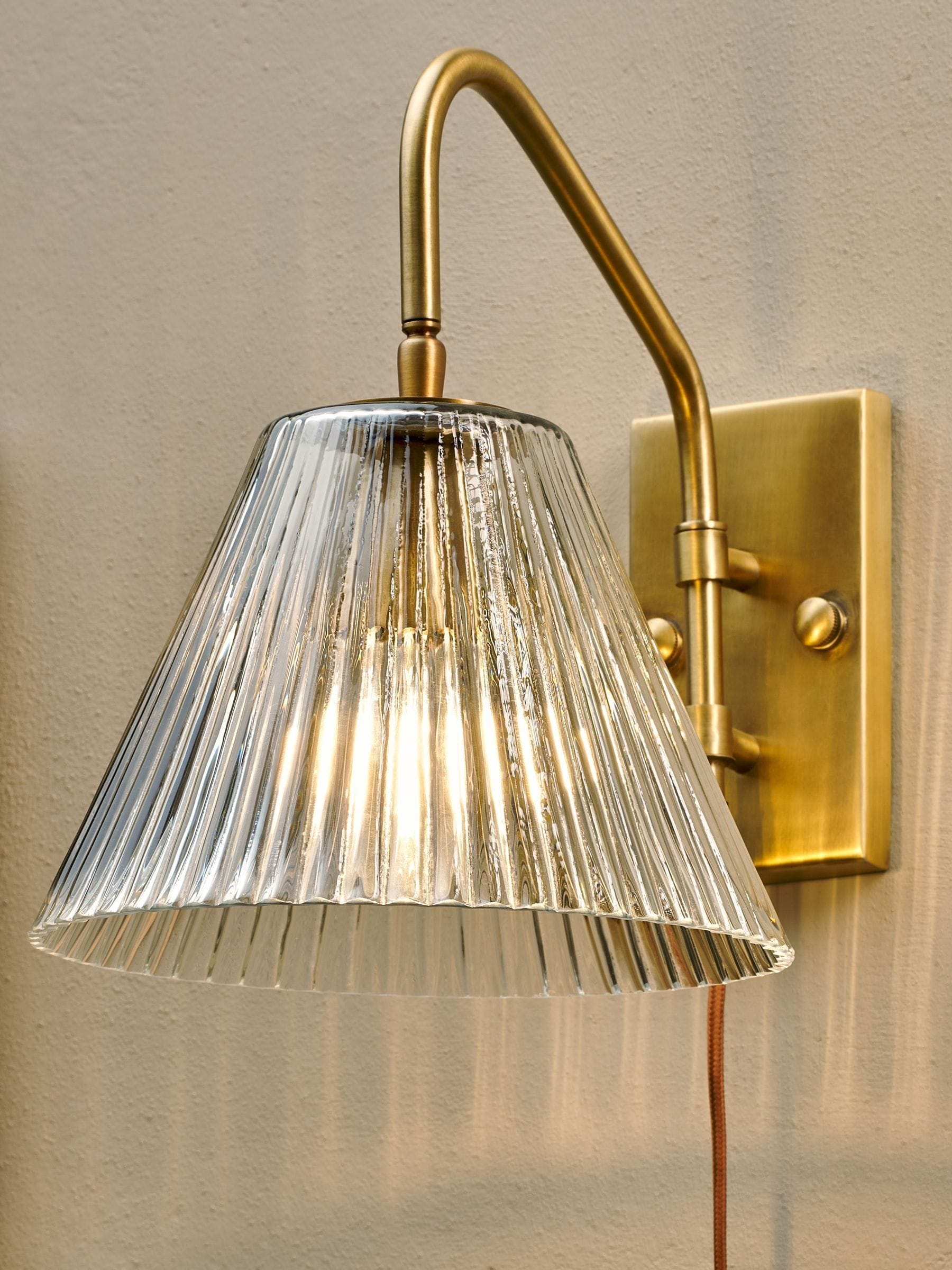 Nkuku antique brass Akoli glass wall lamp, UK version