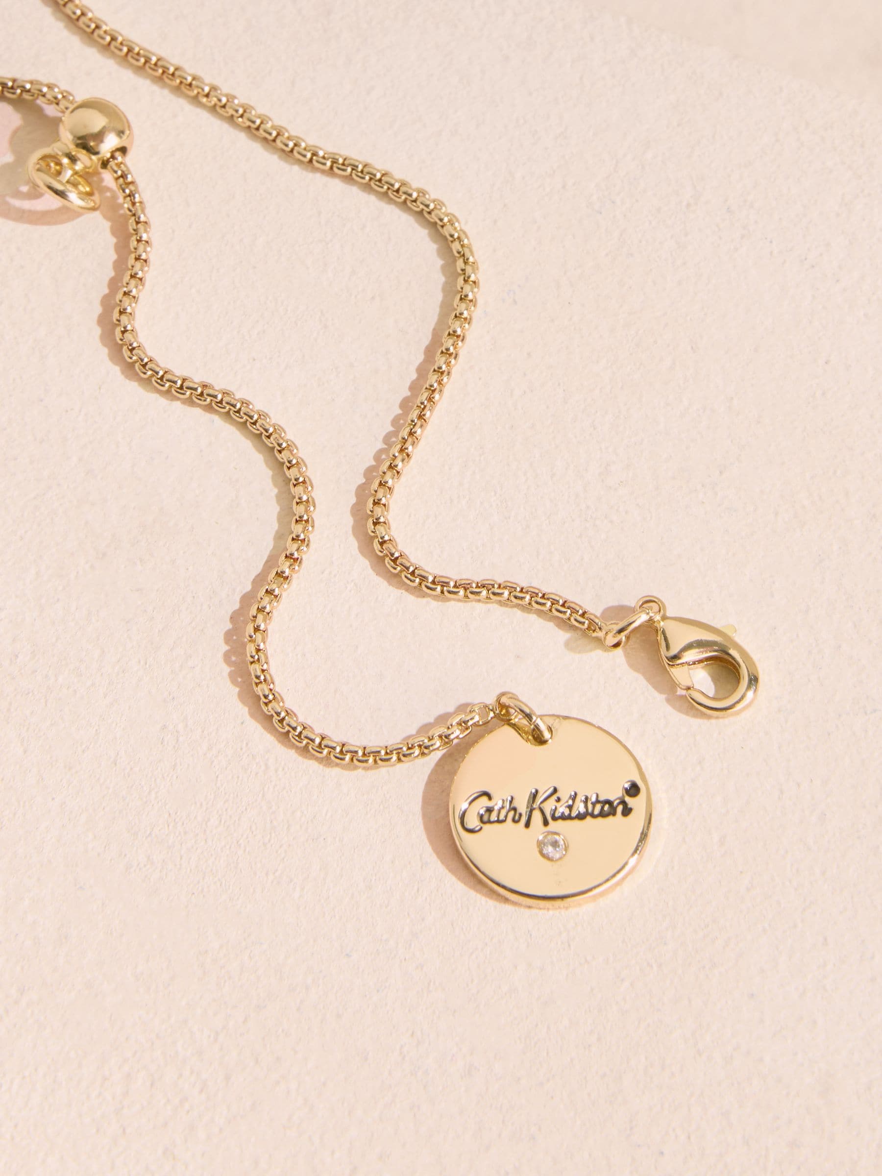 Cath Kidston gold tone arrow necklace with red heart (British brand)