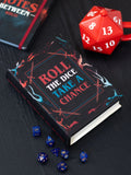 Something Different book-shaped storage box for dice, UK version