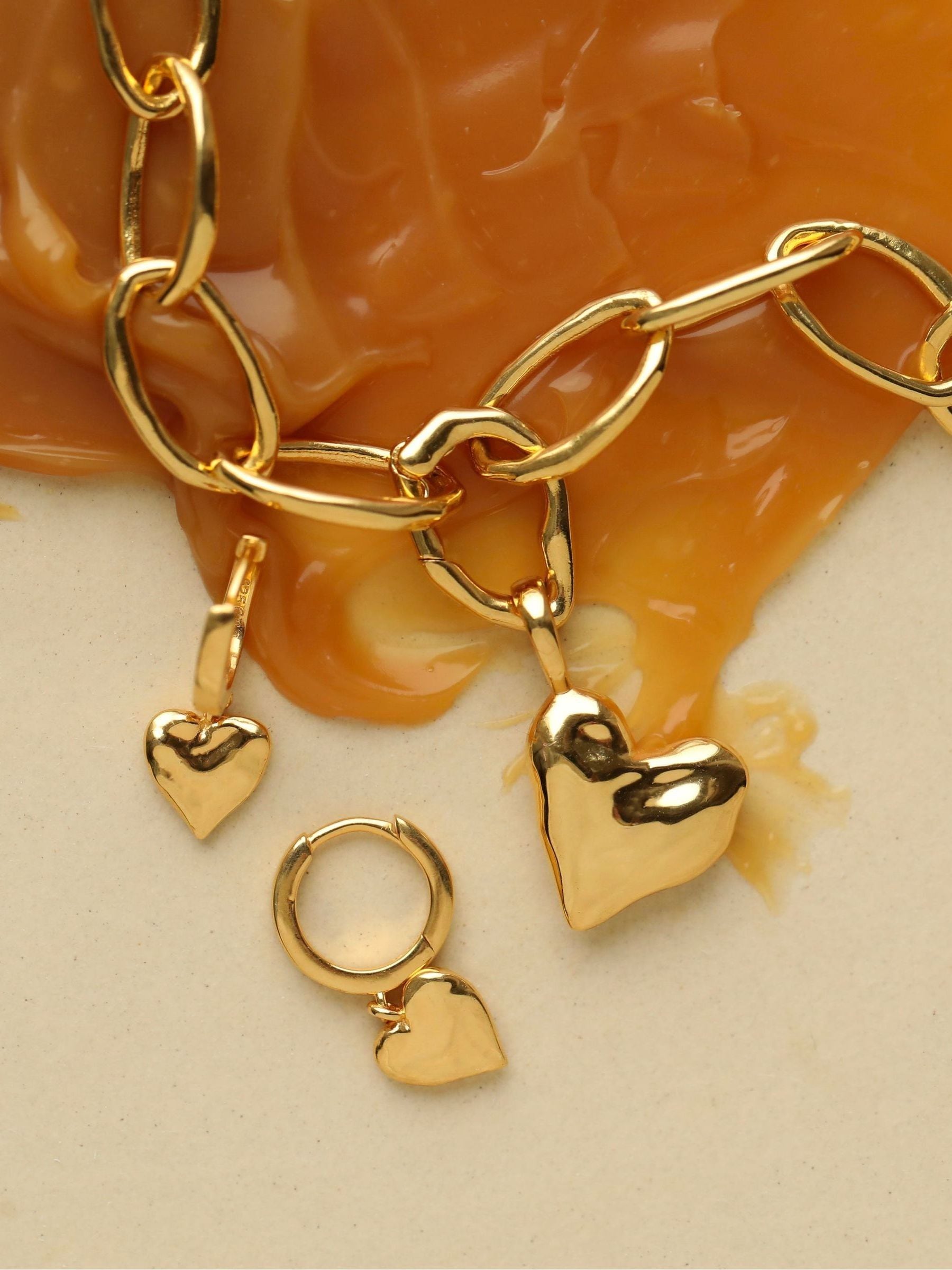 Carrie Elizabeth loveheart drop huggie hoops gold tone, imported from the UK