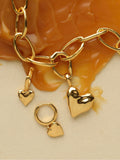 Carrie Elizabeth loveheart drop huggie hoops gold tone, imported from the UK