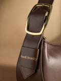 Russell & Bromley Sutton small oval shoulder bag brown (British brand)