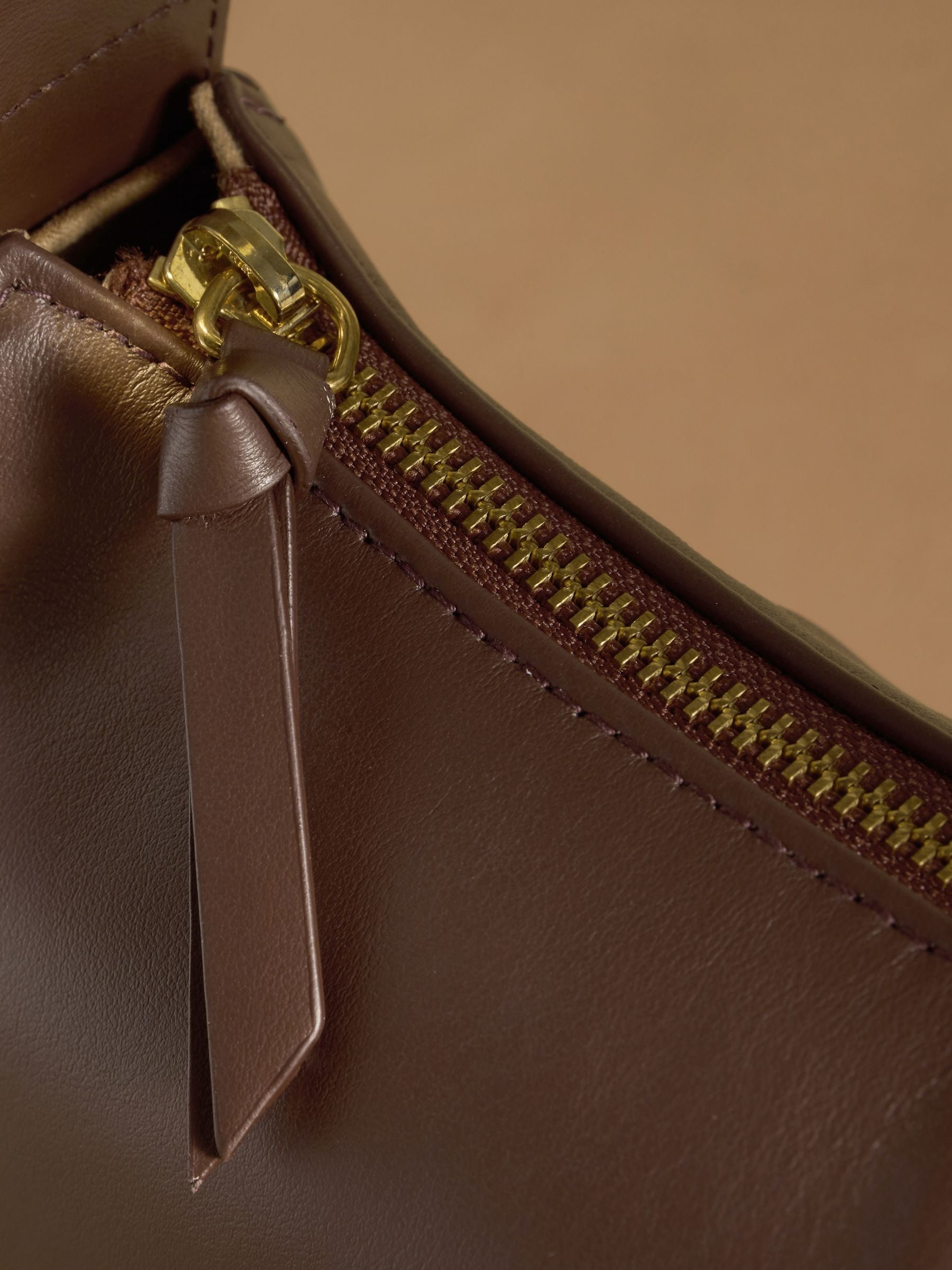 Russell & Bromley Sutton small oval shoulder bag brown (British brand)