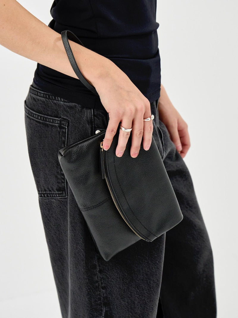 Accessorize black curved foldover leather wristlet bag, imported from the UK