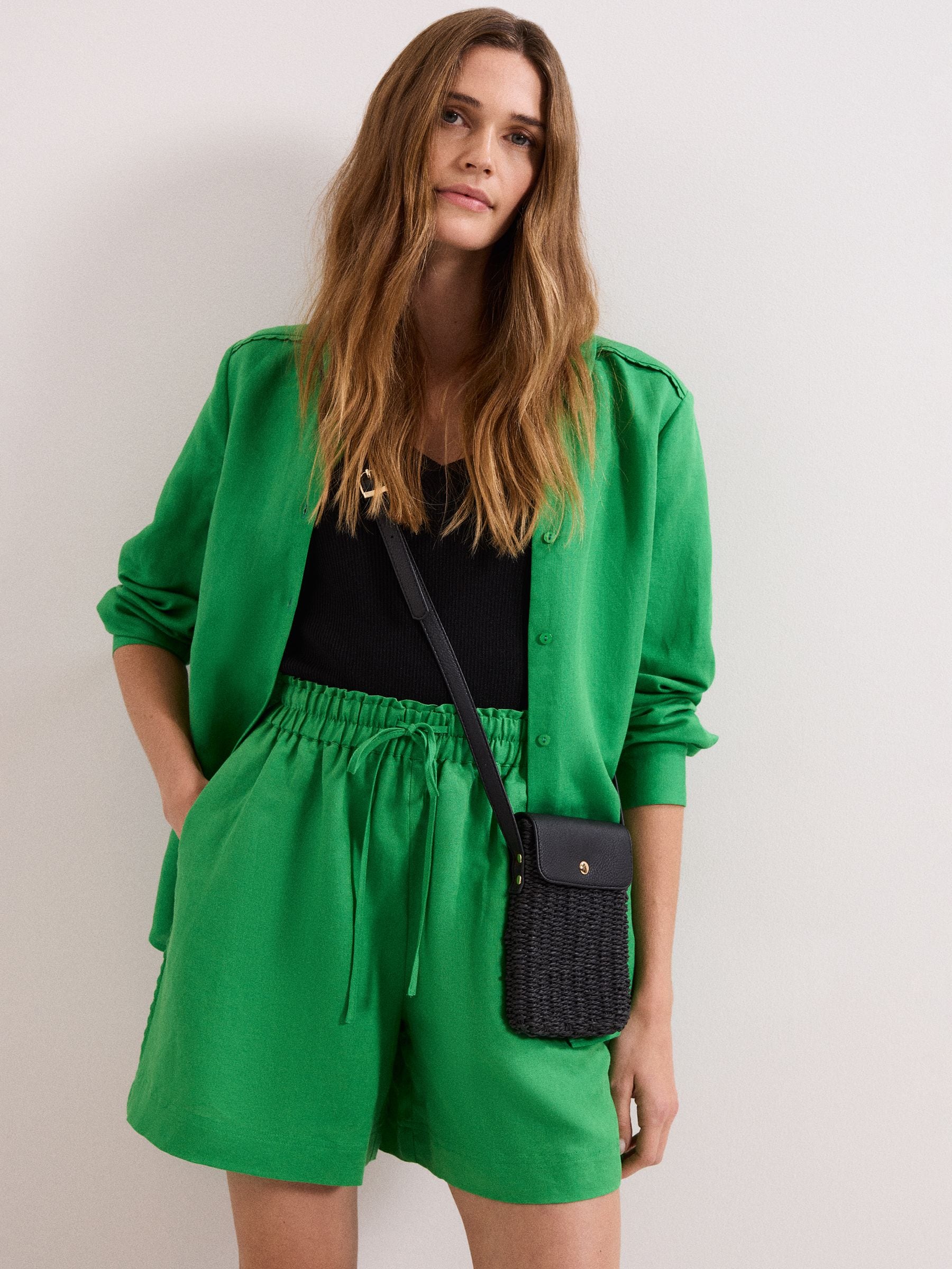 Phase Eight black straw cross-body phone case, imported from the UK