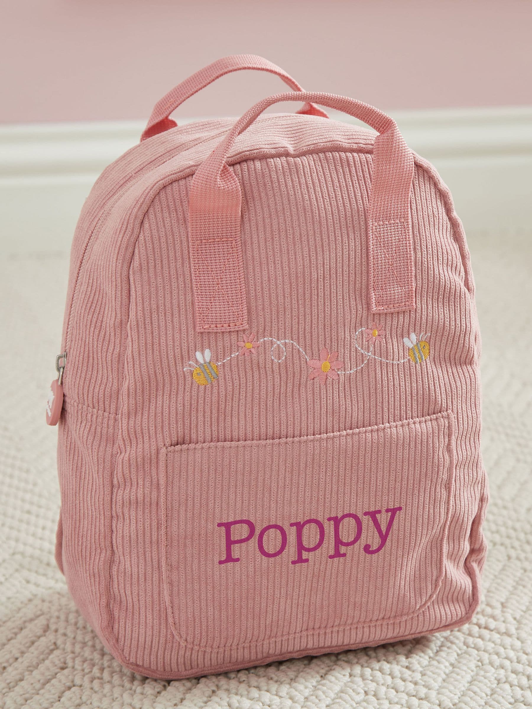 My 1st Years pink bumblebee mini backpack, imported from the UK