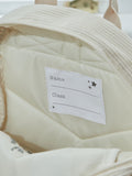 My 1st Years ecru cord backpack with croissant embroidery (British brand)