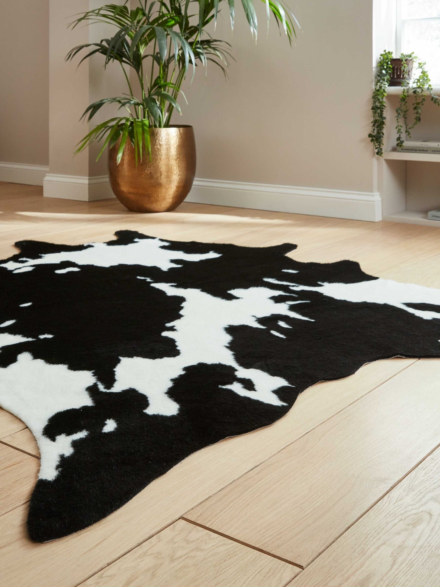 Think Rugs faux cow rug black faux fur, imported from the UK