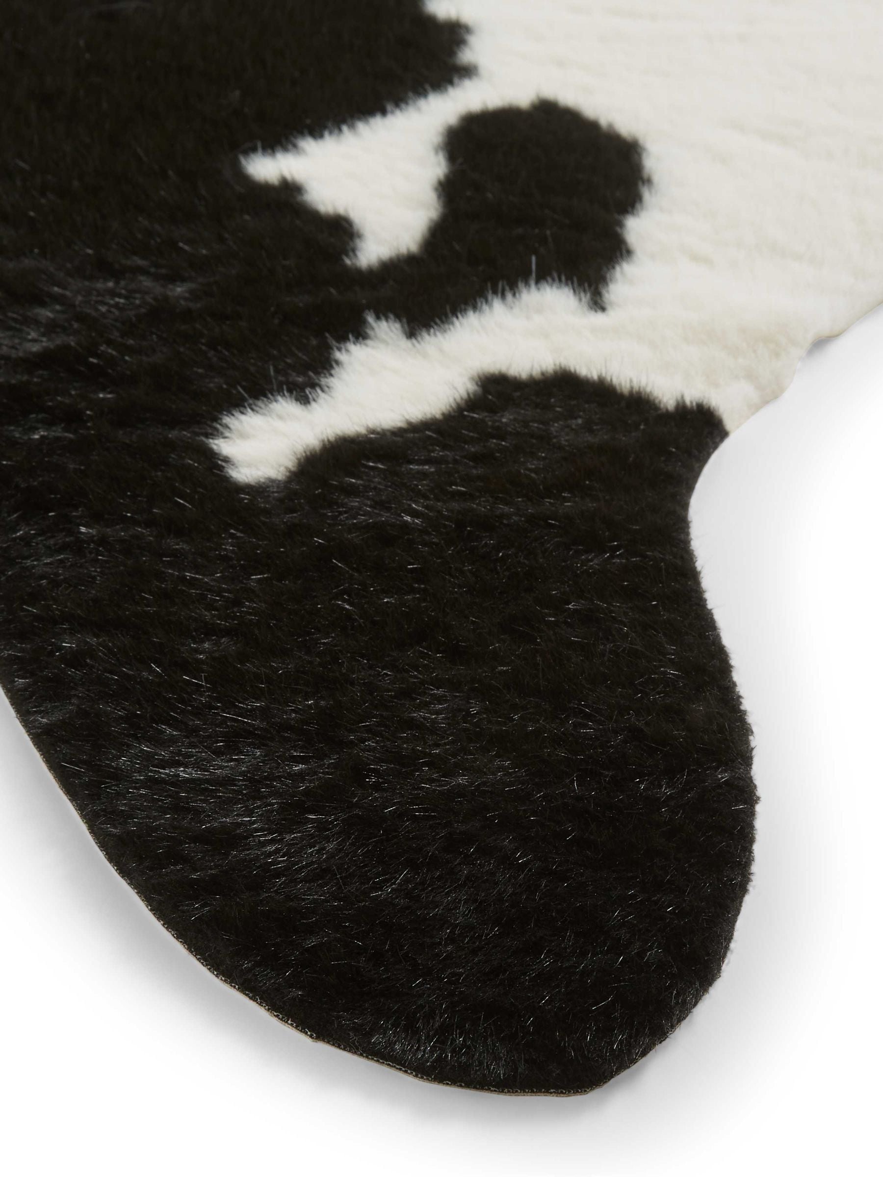 Think Rugs faux cow rug black faux fur, imported from the UK