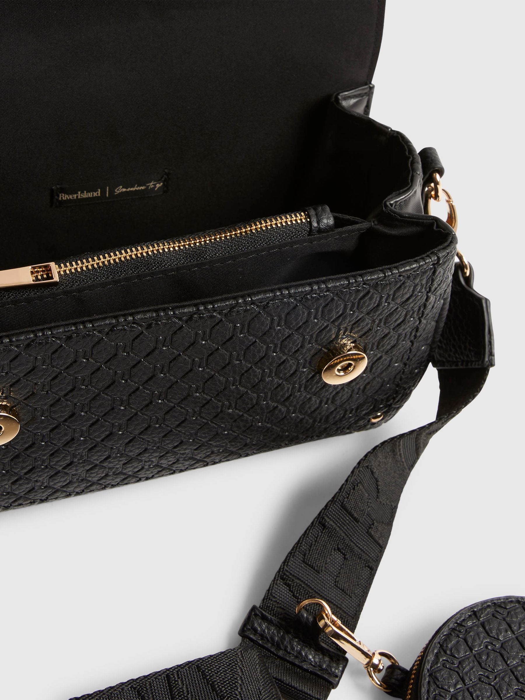 River Island black cross body bag with flap detail, UK version