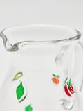 Oliver Bonas clear glass cocktail jug with fruit motifs, imported from the UK