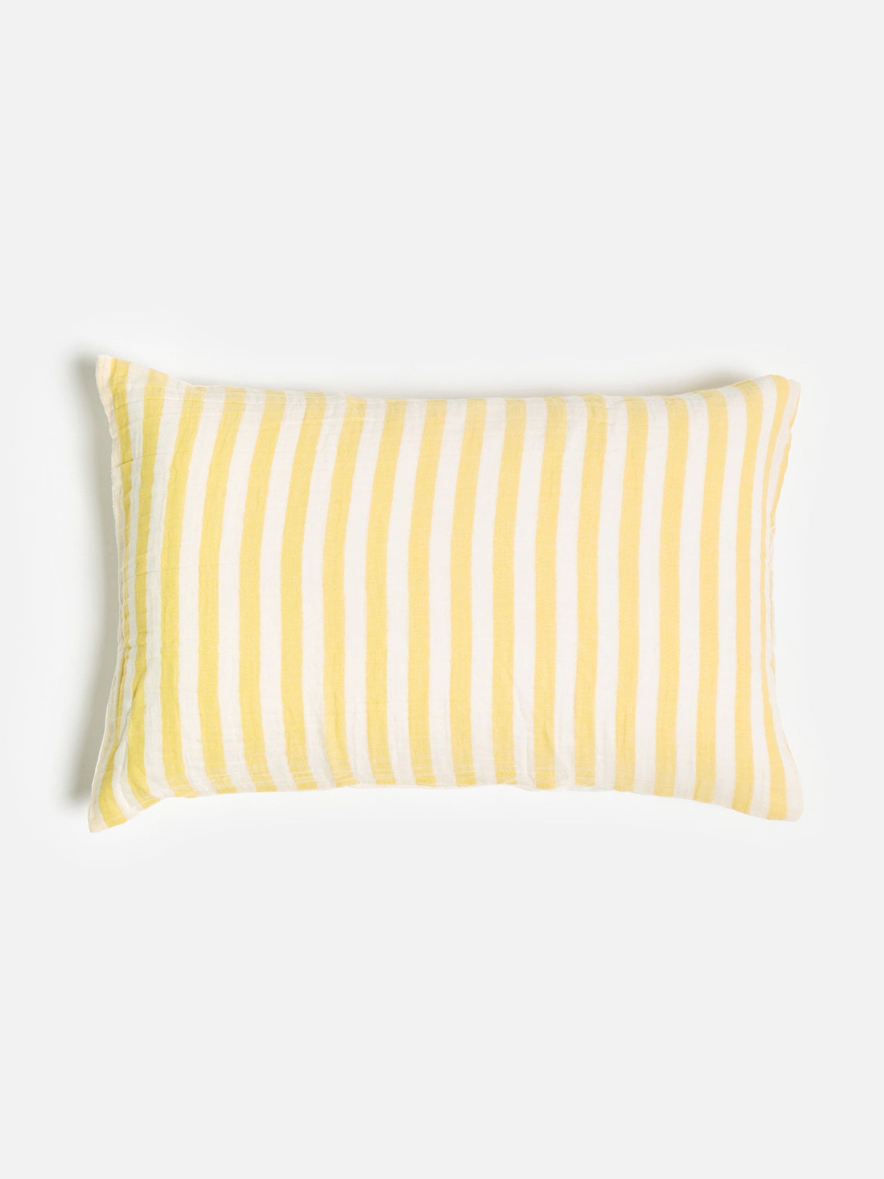 Oliver Bonas yellow muslin striped pillowcases, imported from the UK