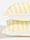 Oliver Bonas yellow muslin striped pillowcases, imported from the UK