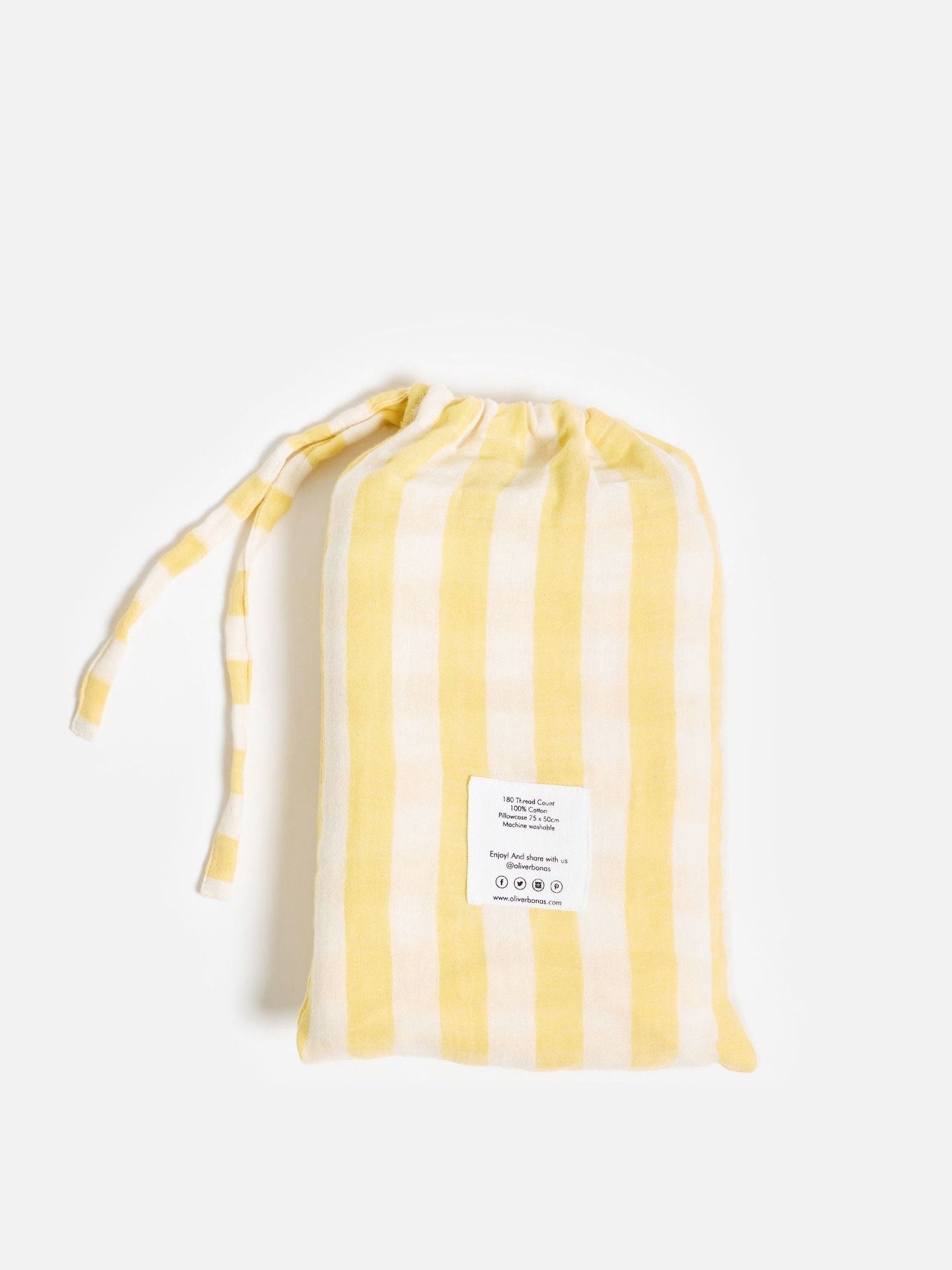 Oliver Bonas yellow muslin striped pillowcases, imported from the UK