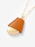 Mint Velvet gold tone faux leather cased pendant necklace, UK version